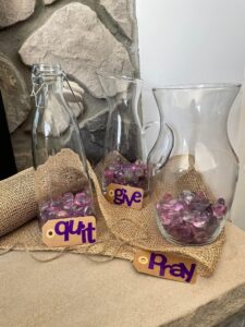 3 glass containers labeled for Lent